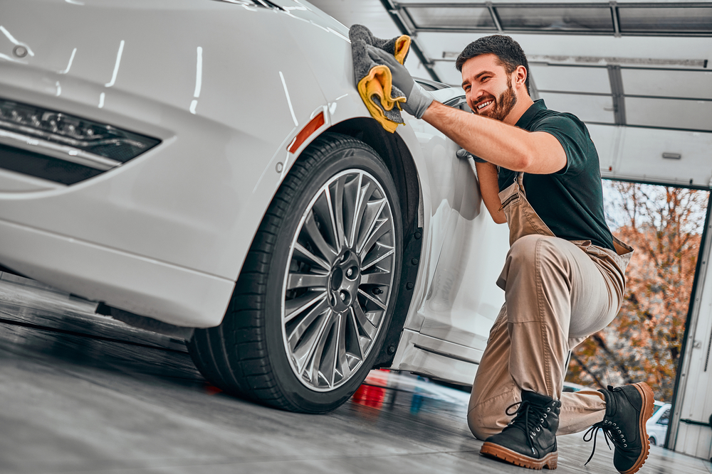 Car,Detailing,Series.,Worker,Cleaning,White,Car.,Selective,Focus.,Low